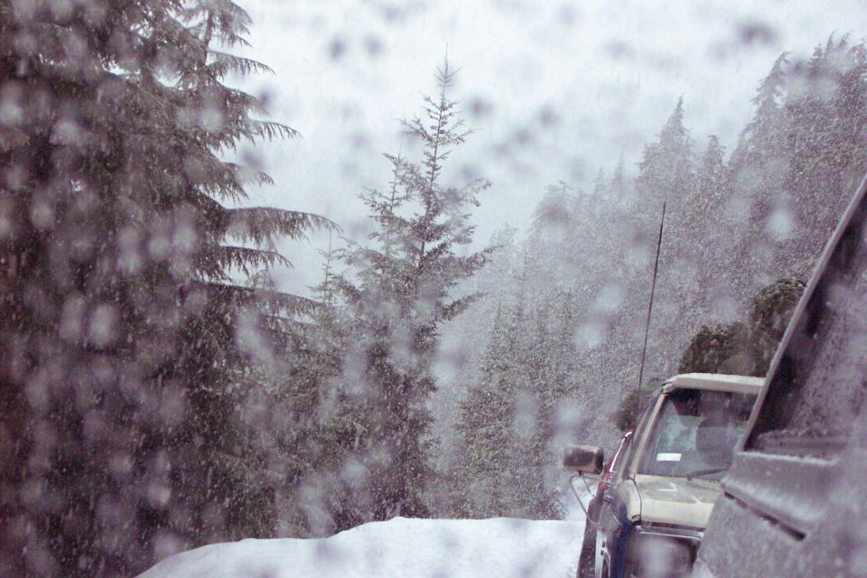 In the rear view mirror is Todd and Jack.  Tim is back there too with a dead Bronco.  We are trapped between the stucks and broken rigs in front and a dead trunk behind us.  But we finally all get out.
  (12/13/2003)