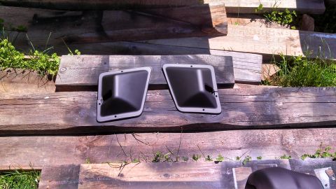 1979 Ford Bronco - Pair of interior door panels displayed on rustic wooden planks outdoors.