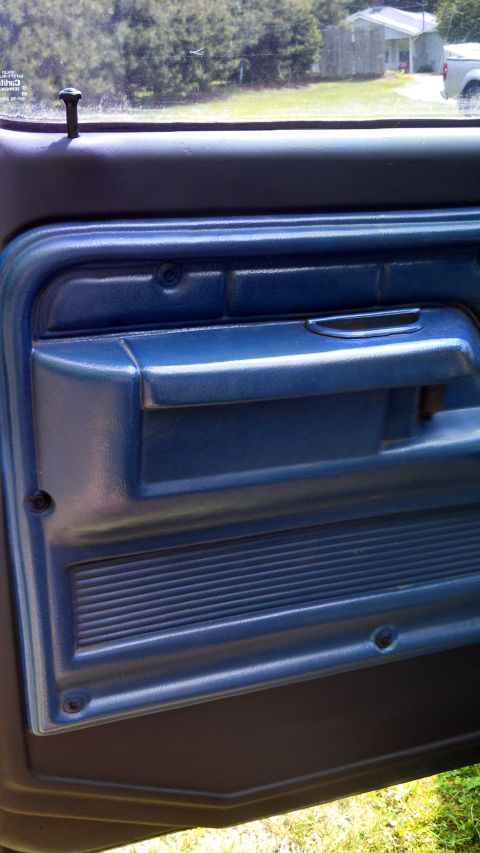1979 Ford Bronco - Interior view of a blue door panel, consistent with a 1979 Ford Bronco.