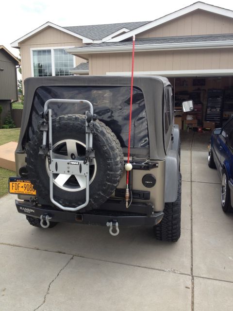 2005 Jeep Wrangler - Rear view of a 2005 Jeep Wrangler showing its spare tire carrier and aftermarket bumper.