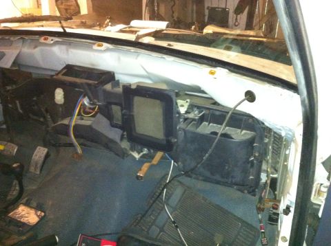 1992 Ford Bronco - The dashboard is disassembled, revealing the inner workings of the vehicle's heating and cooling system.