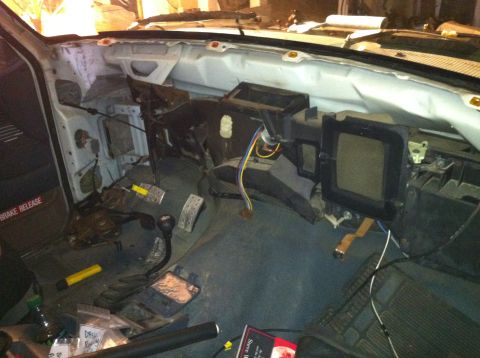 1992 Ford Bronco - The interior of a 1992 Ford Bronco shows a disassembled dashboard with exposed wiring and HVAC systems.