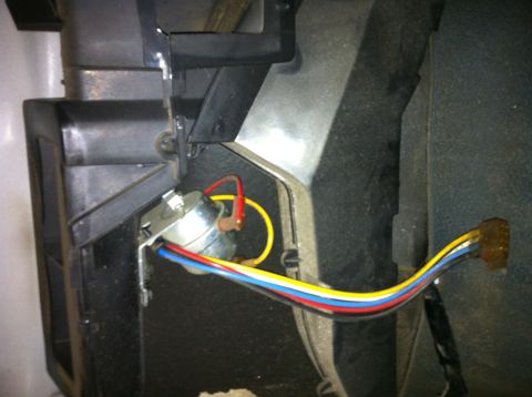 1992 Ford Bronco - A close-up view of a vehicle's interior wiring harness and a switch, with visible text from Supermotors.net.