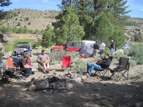 1989 Ford Bronco - A group of people are enjoying a day at a campsite with several Jeep vehicles present.
