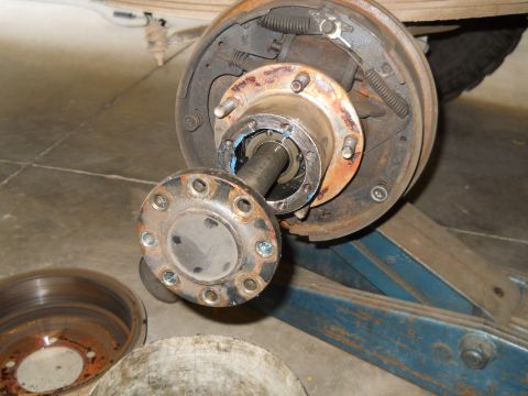 1992 Ford Bronco - Close-up of a vehicle's wheel hub and brake assembly, with the brake drum detached.
