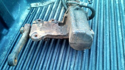 1979 Ford Bronco - This is a close-up of a used power steering gearbox, likely removed from a vehicle for repair or replacement.