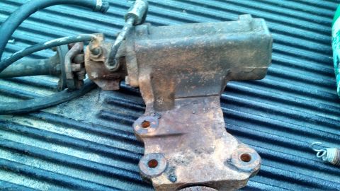 1979 Ford Bronco - A heavily corroded power steering gearbox is visible, likely removed from a vehicle for repair or replacement.