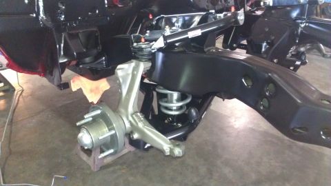 1972 Pontiac Trans Am - Close-up view of a vehicle's front suspension system, showing the steering knuckle, coil spring, and frame components.