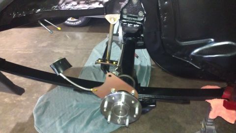 1972 Pontiac Trans Am - Close-up view of a vehicle's rear suspension system, showing the leaf spring and brake components.