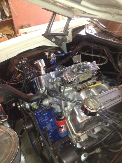 1972 Ford Ranchero - Close-up view of a modified V8 engine in a vehicle's engine bay.