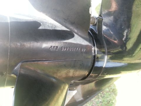 2003 Tracker Tournament - Close-up of a black boat propeller showing stamped identification numbers.