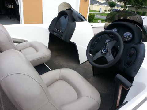 2003 Tracker Tournament - Interior view of a boat, showing the helm, seats, and dashboard.