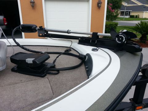 2003 Tracker Tournament - A close-up view of a boat's trolling motor and its foot pedal control, mounted on the deck.