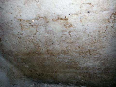 2003 Tracker Tournament - The interior of a boat hull shows signs of wear and tear, with dirt and water stains visible.