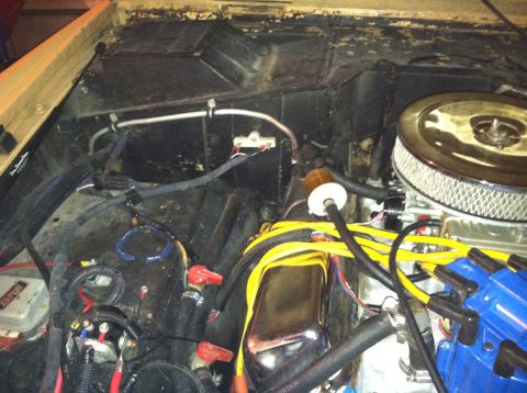 1976 Ford Bronco - Close-up of an engine bay with various components and wiring visible.