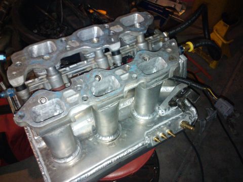 1995 Ford Probe - Close-up view of an aftermarket aluminum intake manifold, likely for a performance application.