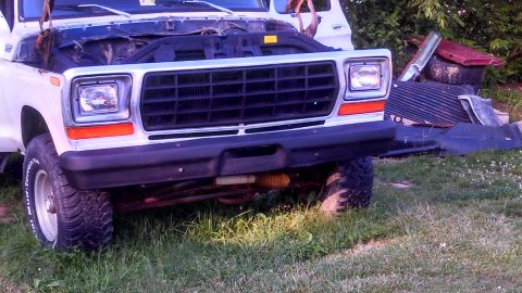 1979 Ford Bronco - Front view of a white 1979 Ford Bronco with its hood open, parked outdoors.