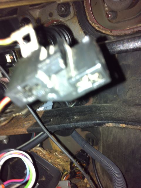 1995 Ford Mustang - Electrical connector for a brake light switch, showing wiring and mounting hardware.