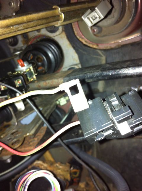 1995 Ford Mustang - Close-up view of a vehicle's brake light switch connector and wiring.