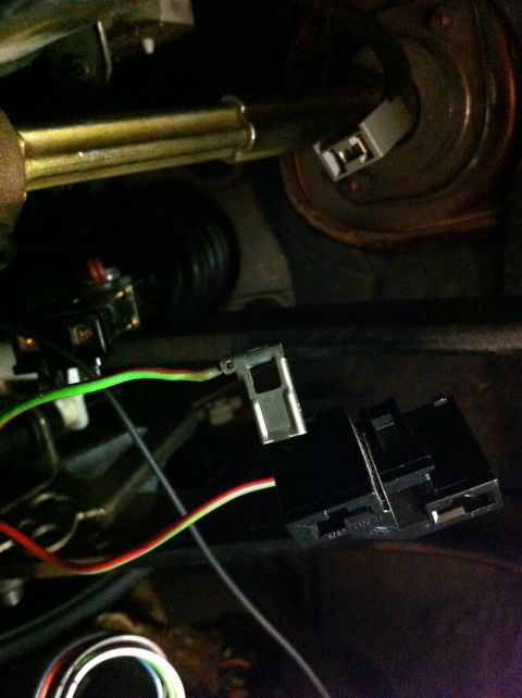 1995 Ford Mustang - Wiring harness connector for brake light switch, showing green and red/yellow wires.