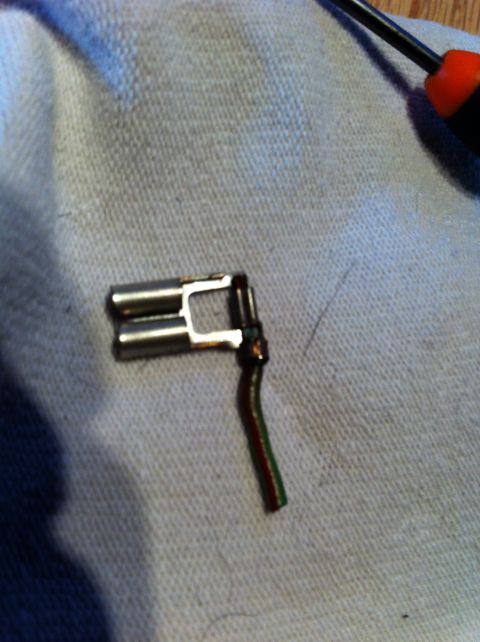 1995 Ford Mustang - This is an electrical connector with red and green wires, likely a replacement part.