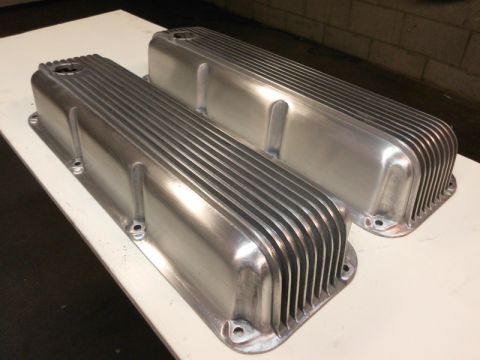 1972 Ford Ranchero - Two aluminum valve covers with a ribbed design are shown on a white surface.