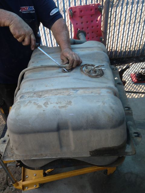1990 Ford Bronco - Servicing a vehicle's fuel tank assembly with a fuel pump module.
