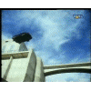 1994 Ford Taurus - A car is seen driving on a bridge under a cloudy sky.