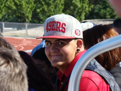 1989 Ford Bronco - A young person smiles while wearing a San Francisco 49ers baseball cap.