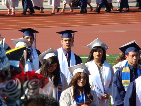 1989 Ford Bronco - Graduates are seen in their caps and gowns during a ceremony.