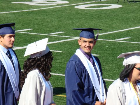 1989 Ford Bronco - Graduation ceremony taking place on a football field.