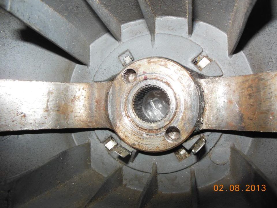 Close-up of splined steering column shaft and mounting flange