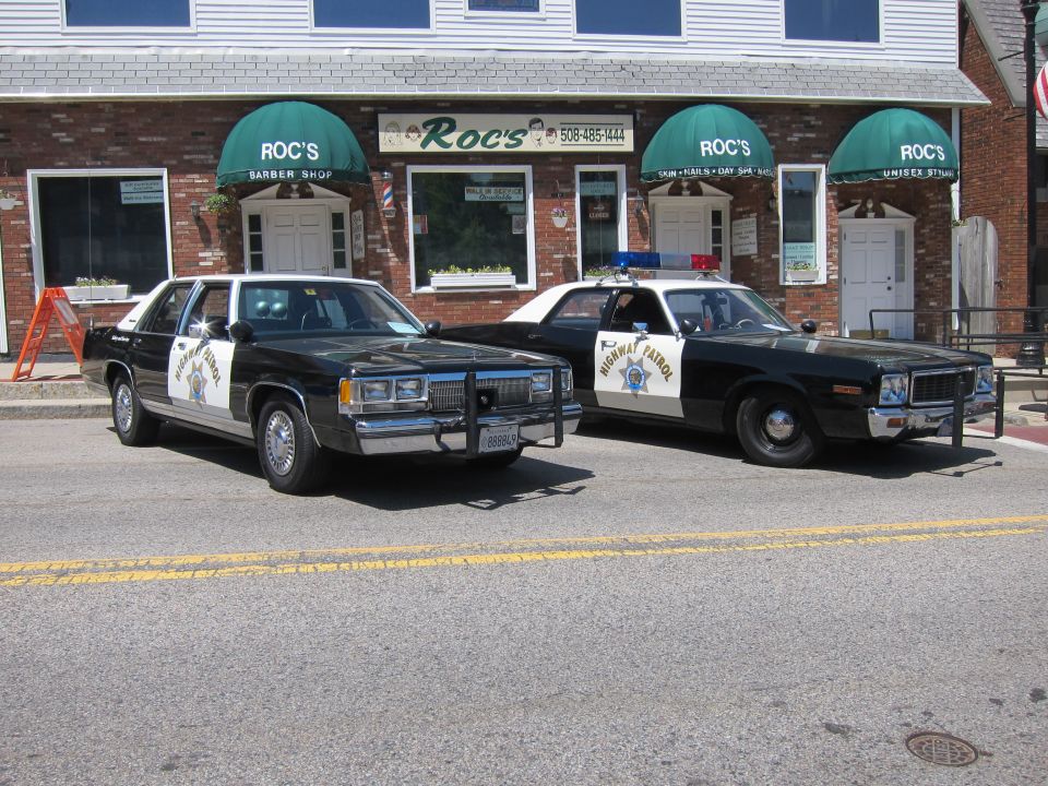 Highway Patrol sedan and an older Highway Patrol coupe parked together