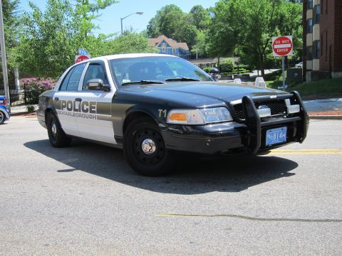 1991 Ford LTD Crown Victoria - Front three-quarter view of a black-and-white Marlborough police cruiser marked T1 with a push bar, parked on a street.