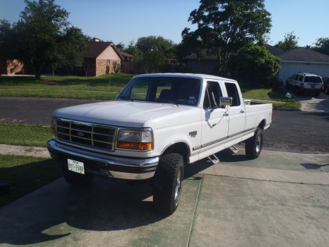 1997 Ford F-350 - White 1997 Ford F-350 pickup truck with crew cab and long bed.