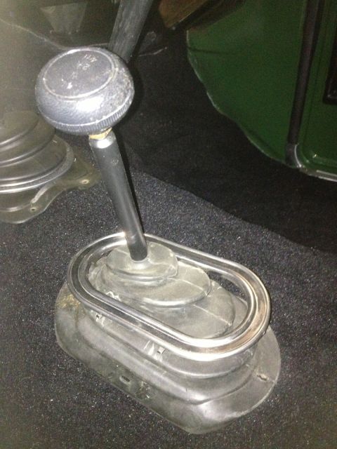 1978 Ford Bronco - Interior shot of a vehicle's shifter knob and boot assembly.
