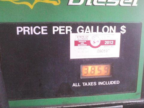 2003 Ford Crown Victoria - A gas pump display shows the price per gallon and an official seal from Illinois.