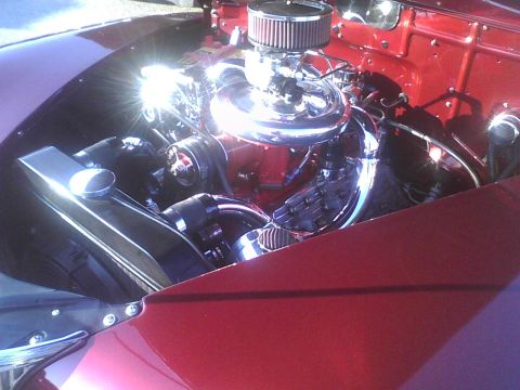 2003 Ford Crown Victoria - Close-up of a polished engine bay a chrome air cleaner and a red engine block.