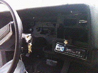 1975 Chevrolet Chevelle - Interior view of a car dashboard, showing an aftermarket radio and steering wheel.