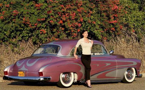 1991 Ford LTD Crown Victoria - A woman poses next to a customized coupe with flame decals and whitewall tires.