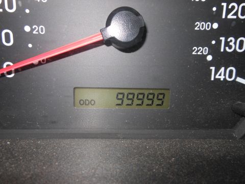 1996 Ford F-150 - The odometer reads 99,999 miles, with the speedometer needle at zero.