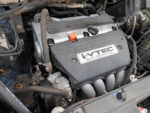 1996 Ford F-150 - The engine bay of a Honda vehicle, showing the i-VTEC 2.4 DOHC engine.