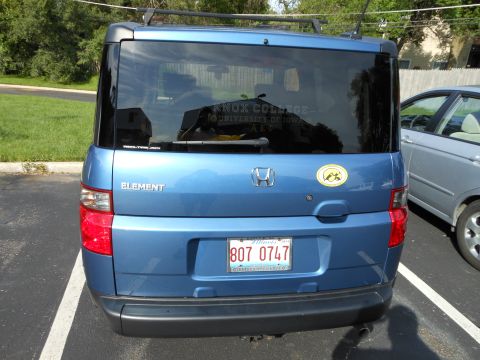 1996 Ford F-150 - Rear view of a blue Honda Element, a license plate and a sticker for Knox College.