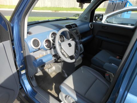 1996 Ford F-150 - Interior view of a blue Honda Element, displaying the dashboard and seating area.