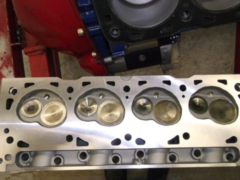 1970 Ford Mustang - A close-up view of a newly machined engine cylinder head, showing the intake and exhaust valves.