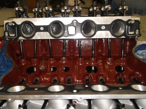 1970 Ford Mustang - Close-up of an engine block assembly, showing internal components and a gasket.