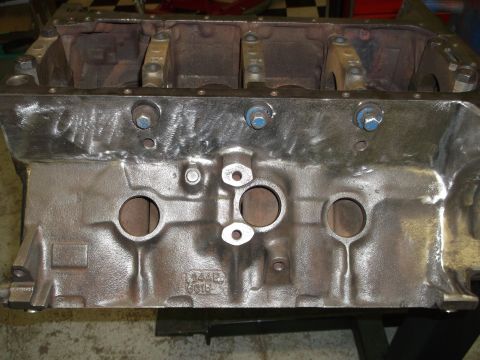 1964 Ford Galaxie - Close-up of a bare engine block, showing casting marks and a website watermark.