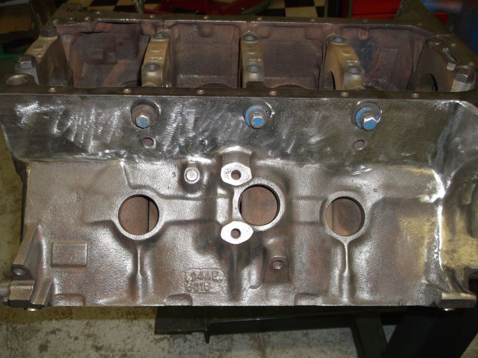 Engine block with visible casting numbers '344B 6015' and 'SUPERMOTORS.NET' watermark