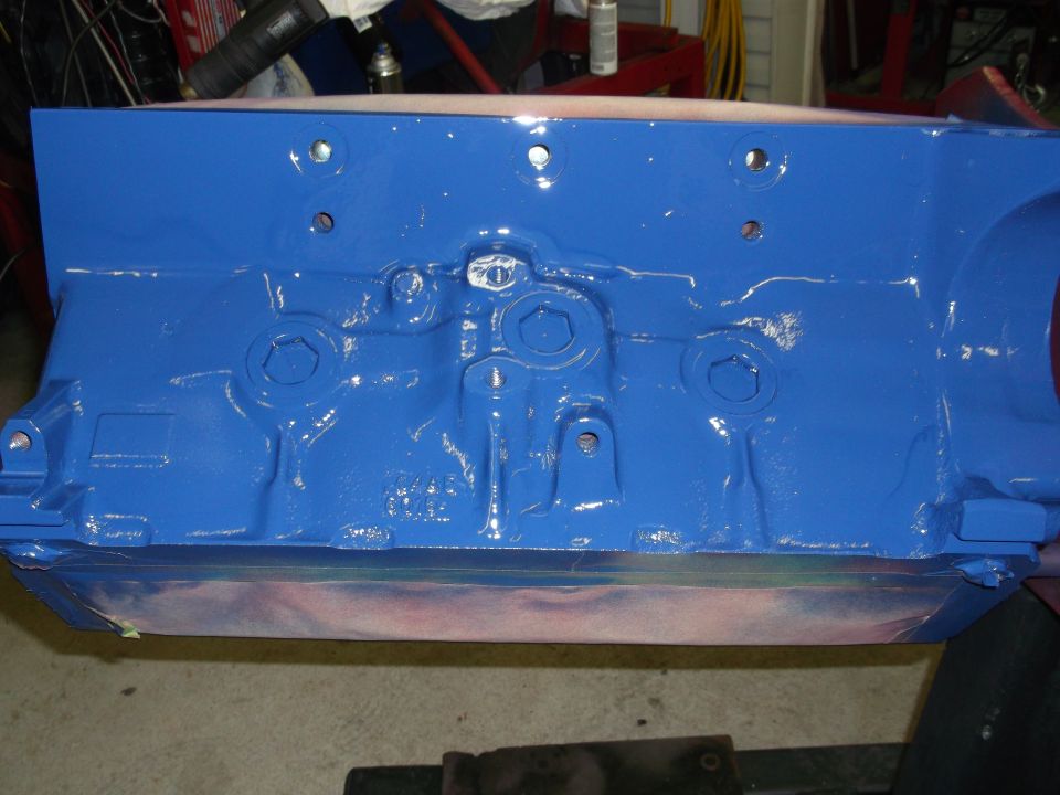 Blue painted engine block with bolt holes visible | SuperMotors.net