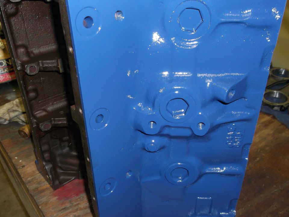 Close-up of a blue painted engine block with some casting marks visible
